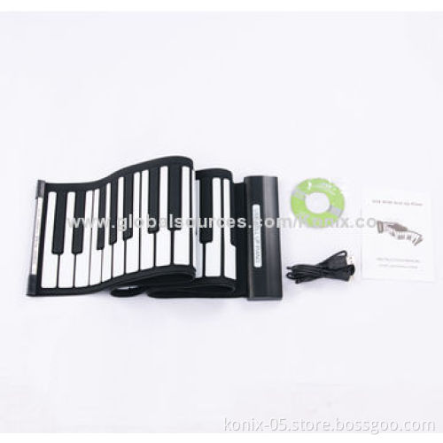Some one play a folding roll up piano for learning